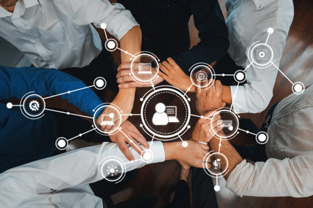 This image captures the essence of collaboration, showcasing diverse hands joining to form a network...