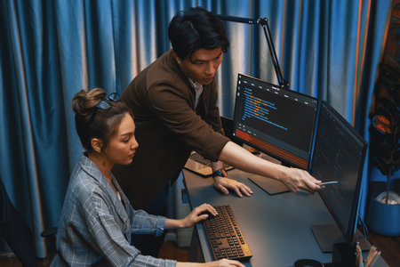 IT developers discussing with point to intelligent website development coder system running data...