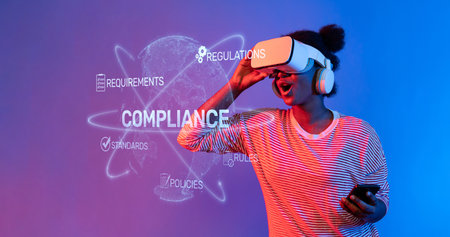 A young woman immerses herself in virtual reality, exploring compliance and regulation concepts in a...