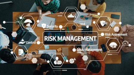 A diverse team engaged in a risk management session, analyzing data and strategies on a table filled...