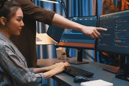 Serious of IT developers discussing intelligent website development system running data online two...