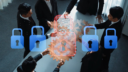 A diverse business team discusses cybersecurity strategies around a conference table, symbolizing...