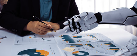 A unique collaboration between a human and a robot in an office setting, showcasing business charts...