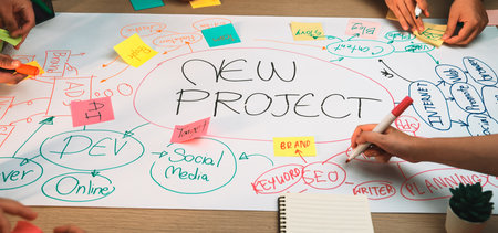 Engaging brainstorming session showcasing hands actively writing and drawing ideas for a new project...