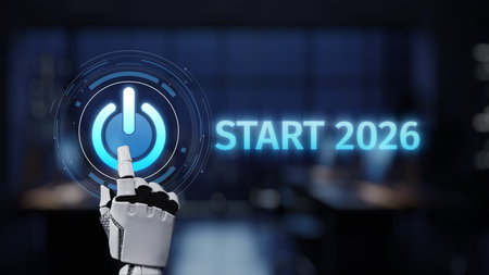A robot hand gently presses a glowing power button labeled "Start 2026," symbolizing future technological advancements and innovation in a modern office environment. Synapseの写真素材