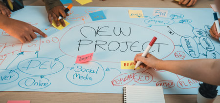 A group of diverse hands collaborating on a new project during a brainstorming session. Colorful...