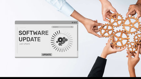 This image showcases hands connecting wooden gears in front of a software update interface,...