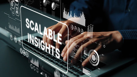 Hands Typing on Laptop with Graphs and Data Visualizations for Scalable Insights in Business...
