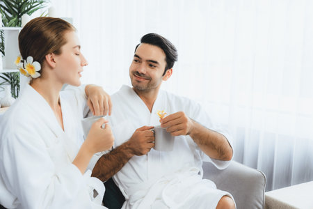 Beauty or body treatment spa salon vacation lifestyle concept with couple wearing bathrobe relaxing...
