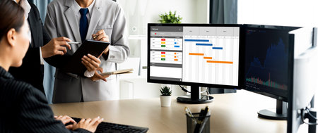 Project planning software for brisk business project management on the computer screen showing...