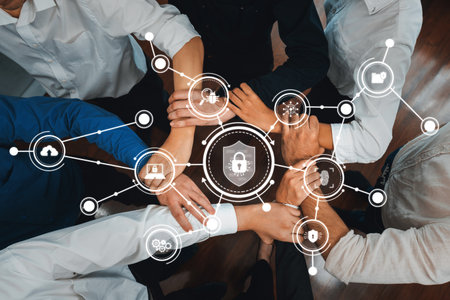 Capturing the essence of teamwork, this image showcases diverse hands joined together with icons symbolizing security, digital protection, and safety strategies for thriving organizations. Amityの写真素材