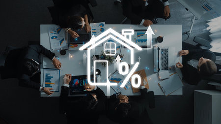 A group of professionals engaged in a business meeting, analyzing real estate trends with financial...