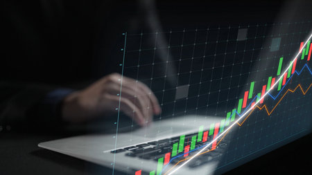 A businessman studies financial data on a laptop, surrounded by vibrant graphs showing growth...