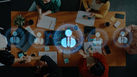 A diverse group of professionals collaborates at a conference table, engaged in business strategy...