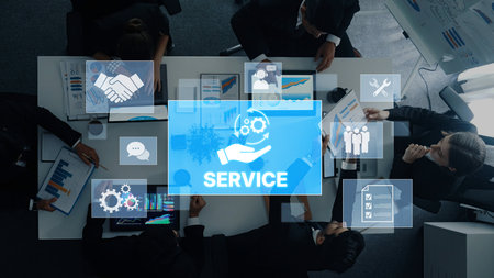 A business team collaborates in a modern workspace, discussing service strategies surrounded by...