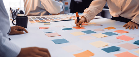 A vibrant office scene captures a diverse team engaged in a brainstorming session, utilizing sticky...