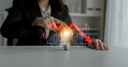 Economic caution visualized with fluctuating market graph, alert symbols, and negative data trends....