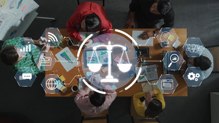 A diverse group of professionals collaborates on a legal and business strategy at a modern office,...