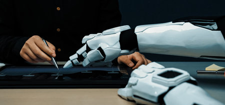 A human and robotic hand collaborate on a digital interface, showcasing the intersection of...