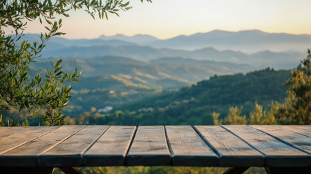Captivating scene featuring a wooden table overlooking a stunning mountain landscape at sunrise. This image evokes a sense of peace and tranquility ideal for outdoor themes.の素材
