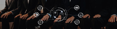A group of professionals in formal attire sit together in a contemporary office, engaged in...