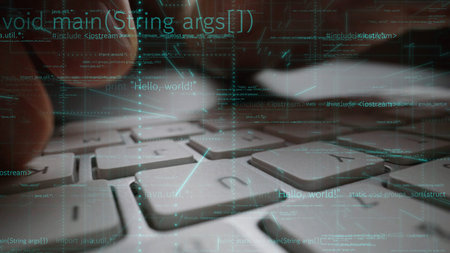 This image captures hands typing on a keyboard surrounded by programming code visuals. It highlights...