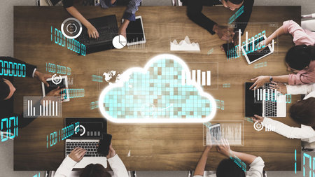 Aerial view of a collaborative business meeting featuring cloud technology and data visualization....