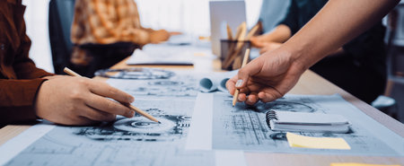 A dynamic group of creative professionals engages in collaborative design efforts at a modern...