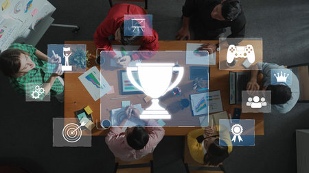 A diverse group of professionals collaborates in a modern workspace, discussing gamification...