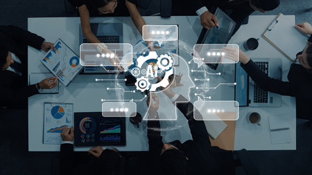 Busy business team collaborates in a modern office setting, using digital tools for data analysis and brainstorming innovative strategies for growth and success.の写真素材