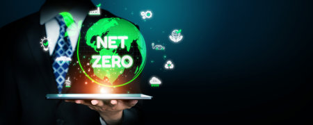 Digital globe with Net Zero surrounded by sustainability icons, representing the goal of reducing...