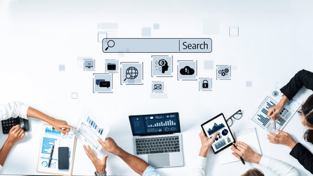 Dynamic scene showcasing business professionals collaborating with technology and data analysis tools in an office setting, emphasizing teamwork and research activities.の写真素材