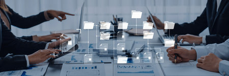 A group of business professionals engaged in a collaborative meeting, analyzing data and discussing...