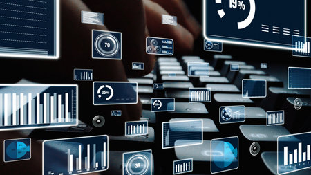 Close-up view of hands on a keyboard, surrounded by digital graphs and charts. This image symbolizes...