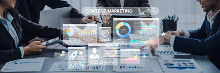 A diverse team collaborates on a digital marketing strategy using data analytics and statistics on screens to enhance content marketing efforts and drive business growth.の写真素材