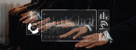 Group of business professionals engaged in a meeting, with a digital interface displaying analytics...