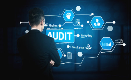 A business professional stands in front of a digital interface, engaging with various audit and compliance concepts, emphasizing data analysis and innovation. Tesselの写真素材