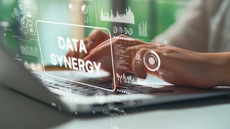 Modern Office Setting with Hands on Laptop and Data Visualization Concepts Representing Data Synergy and Innovation. Asymptotic smart data analytic.の写真素材
