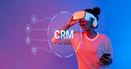 A dynamic scene showcasing a person in virtual reality engaging with customer relationship management tools. The vibrant atmosphere highlights technology and interactive experiences.の写真素材