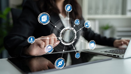A businesswoman interacts with a digital interface displaying various technology icons, symbolizing...
