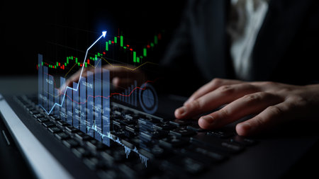 A business professional analyzes stock market trends on a laptop, featuring clear financial graphs and data. The scene highlights modern investment strategies.の写真素材