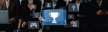 A group of business professionals engaged with technology, showcasing symbols of achievement and collaboration in a modern office environment.の写真素材