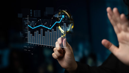 A businessman examines digital data trends using advanced technology in a modern office setting, showcasing interactive graphs and insightful analytics for strategic decisions.の写真素材
