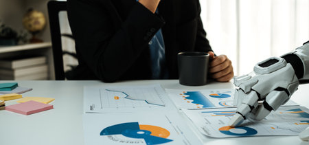 A business professional contemplates analysis in a modern office while interacting with charts and...