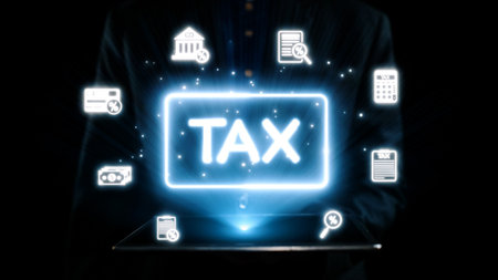 This image depicts a glowing 'TAX' displayed on a tablet surrounded by various financial icons, highlighting modern financial management and taxation strategies.の写真素材