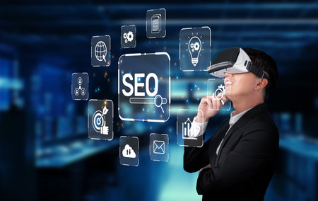 A businessman wearing a virtual reality headset contemplates SEO strategies, surrounded by technology icons in a modern office, illustrating the future of digital optimization.の写真素材
