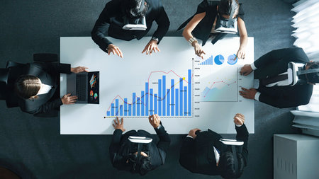 A business team engages in innovative data analysis using virtual reality technology in a modern...