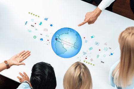 A team of diverse professionals collaborates around a table, pointing towards a glowing 3D globe...