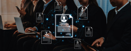 Concept of global talent acquisition and hiring. Human resources department reviewing candidate curriculum vitae and resumes for a job search and workforce selection process.の写真素材