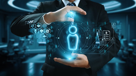 A professional businessman showcases a digital icon surrounded by technology elements, representing innovation and data management solutions in a modern office environment.の写真素材